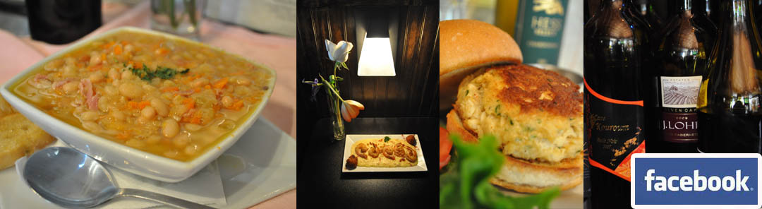 a heaping bowl of white bean and bacon soup ready to be eaten. A trapezoidal wall sconce on a dark backdrop illuminating a rectangular plate showcasing a jumbo fried shrimp entree and a table decorated with elegant flowers.
				      A tasty warm sandwich on a golden toasted bun. A close-up view of 3 bottles of wine with a variety of different colorful labels.
